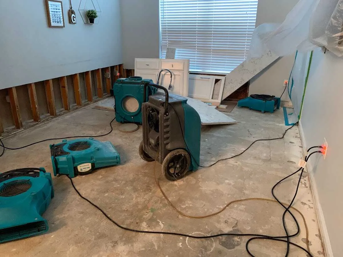 Dehumidifier in flood-cut room for Water Damage Restoration in La Follette